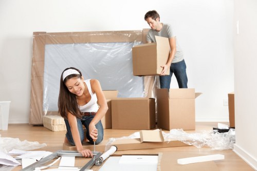 Packing boxes and organised moving supplies in a Deptford home