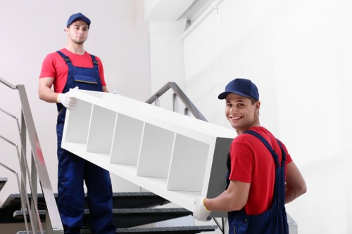 Removal team planning a move in a Deptford street