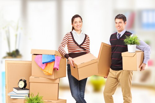 Unpacking boxes and arranging items in a new Deptford property