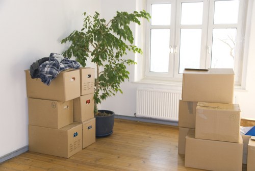 Professional movers handling household items in Deptford