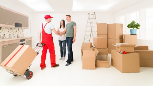 Local moving team preparing belongings for transport in Deptford