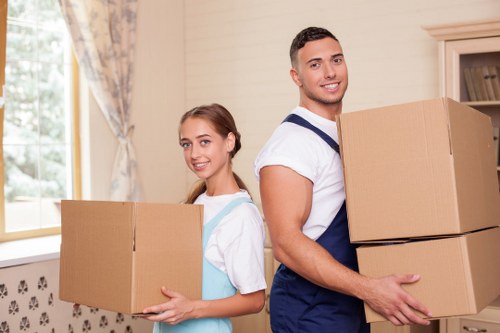 Careful loading of boxes and household items into a removal van